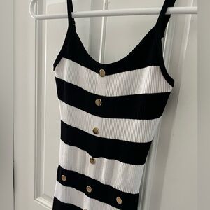 Black and white striped dress with gold buttons